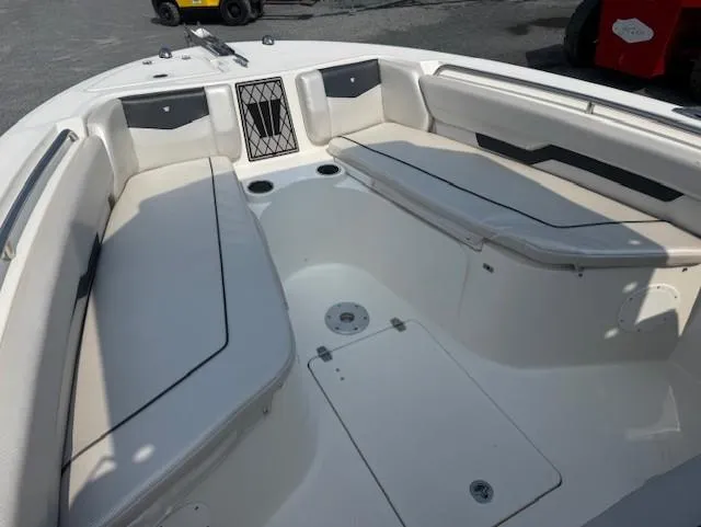 Slide: The Image of 2018 Wellcraft 222 Fisherman boat interior with spacious seating and storage compartments. - 15