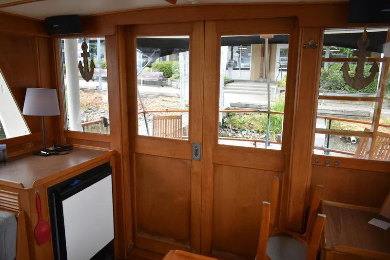 Slide: The Image of Interior of 1980 Grand Banks 42 Europa yacht with wooden doors and nautical decor. - 13
