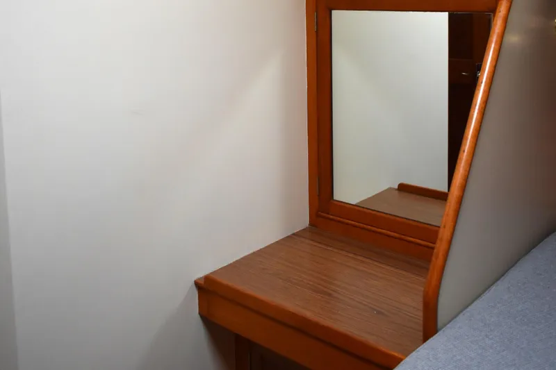 Slide: The Image of Wooden vanity area with mirror on 1980 Grand Banks 42 Europa yacht. - 15