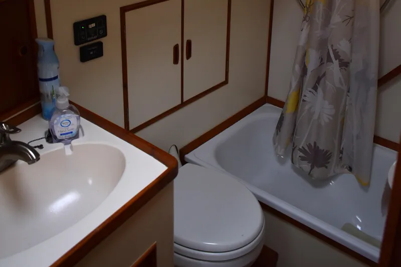 Slide: The Image of Bathroom interior of 1980 Grand Banks 42 Europa yacht with sink, toilet, and shower. - 16