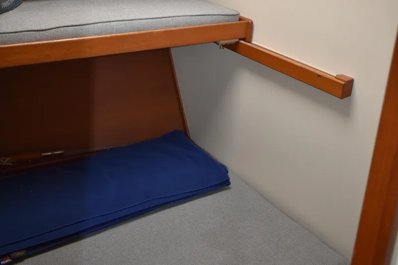 Slide: The Image of Interior cabin of 1980 Grand Banks 42 Europa with wooden trim and blue cushion. - 17