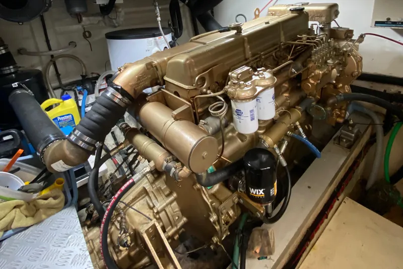 Slide: The Image of Engine room of a 1980 Grand Banks 42 Europa yacht, showcasing detailed machinery. - 18
