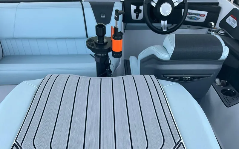 Slide: The Image of 2025 Nautique Ski boat interior with modern seating and steering wheel design. - 4