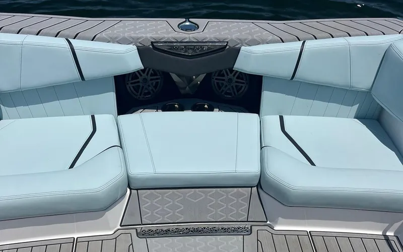 Slide: The Image of 2025 Nautique Ski boat interior with light blue seating and modern design. - 5