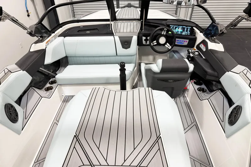 Slide: The Image of 2025 Nautique Ski Nautique boat interior with modern dashboard and seating. - 7