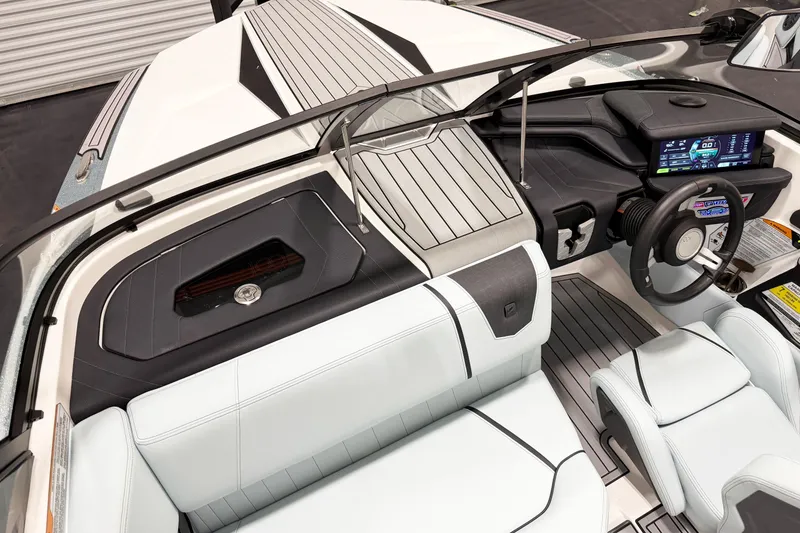 Slide: The Image of 2025 Nautique Ski Nautique interior with modern dashboard, sleek seating, and advanced controls. - 8