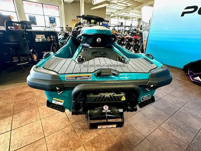 Slide: The Image of 2025 Sea-Doo GTX Limited 325 jet ski displayed in showroom, rear view. - 10