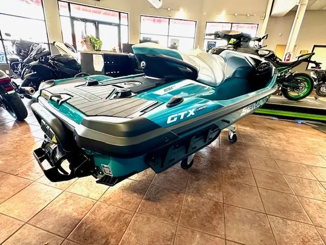 Slide: The Image of 2025 Sea-Doo GTX Limited 325 jet ski displayed in a showroom. - 11