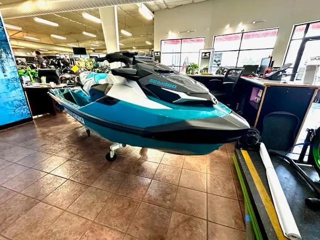 Slide: The Image of 2025 Sea-Doo GTX Limited 325 jet ski displayed indoors on a showroom floor. - 3