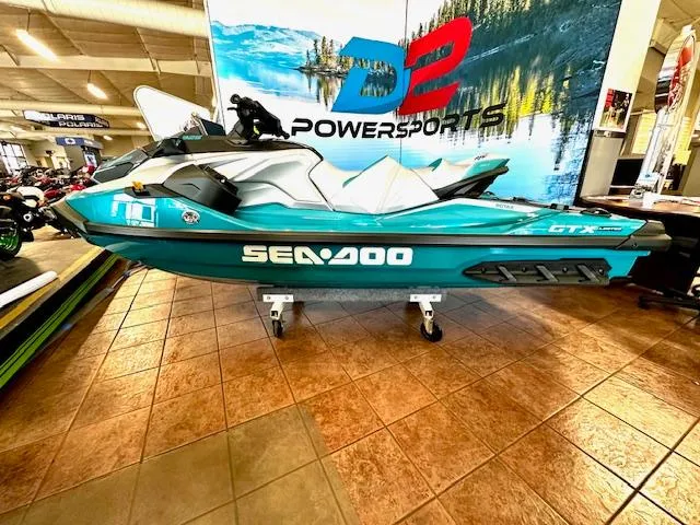 Slide: The Image of 2025 Sea-Doo GTX Limited 325 jet ski displayed at D2 Powersports showroom. - 7