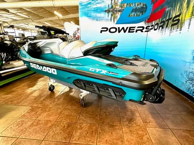 Slide: The Image of 2025 Sea-Doo GTX Limited 325 jet ski displayed indoors at a powersports showroom. - 8