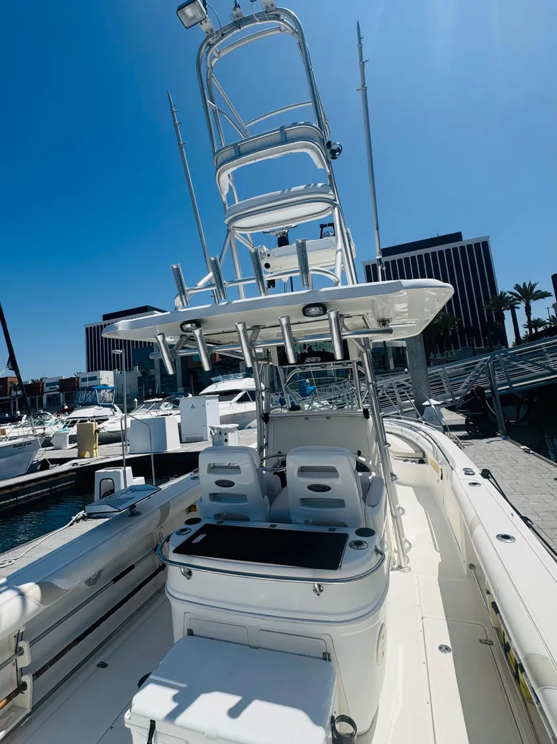 Slide: The Image of 2007 Boston Whaler 320 Outrage boat docked at marina under clear blue sky. - 11