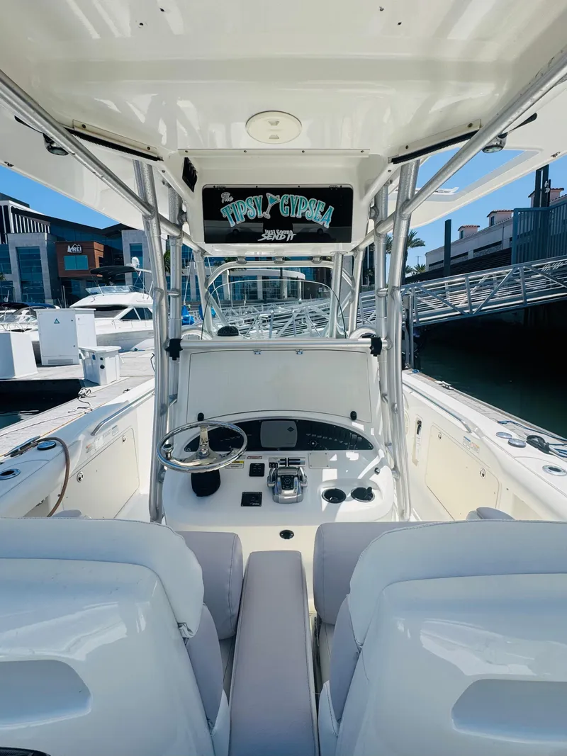 Slide: The Image of 2007 Boston Whaler 320 Outrage boat interior with steering console and seating. - 14