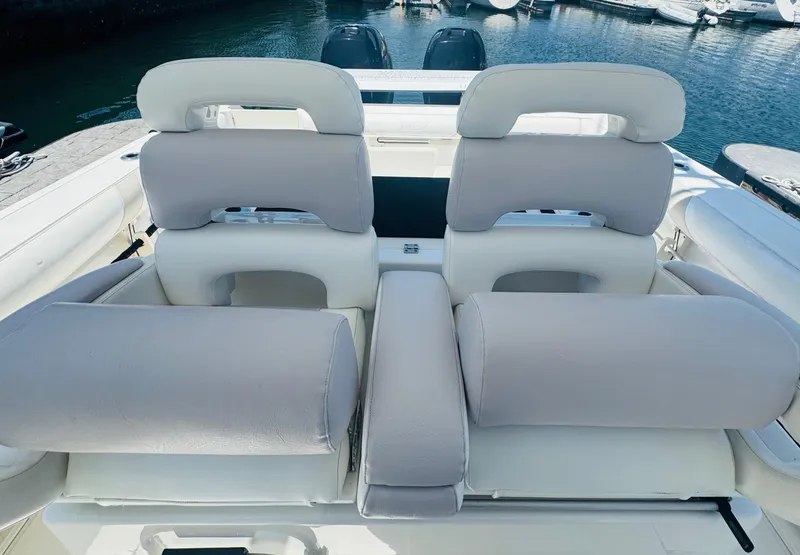 Slide: The Image of 2007 Boston Whaler 320 Outrage boat seats, docked in a marina. - 23