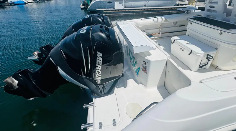 Slide: The Image of 2007 Boston Whaler 320 Outrage with twin Mercury Verado engines docked at marina. - 27