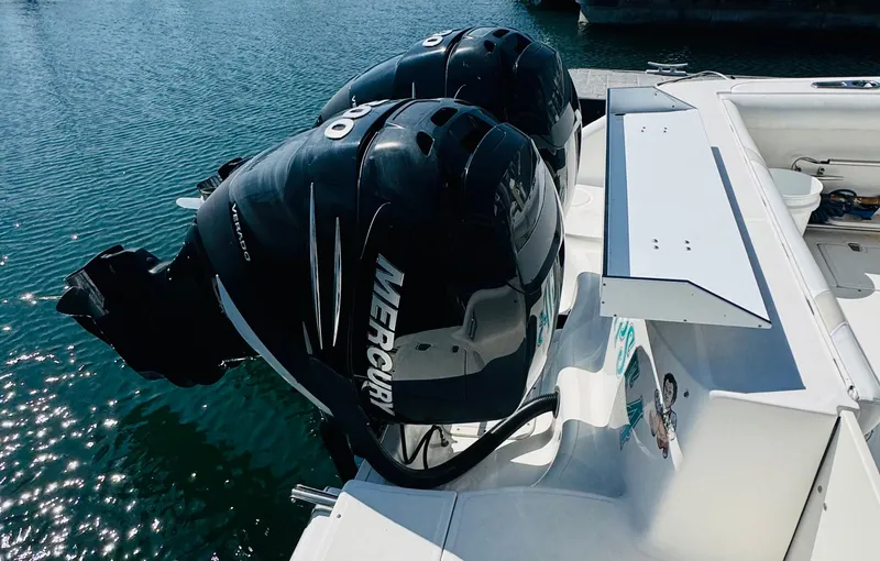 Slide: The Image of Twin Mercury outboard engines on a 2007 Boston Whaler 320 Outrage boat. - 28