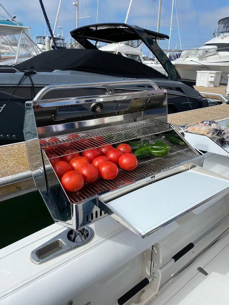 Slide: The Image of Grill with tomatoes and peppers on a 2007 Boston Whaler 320 Outrage boat. - 30