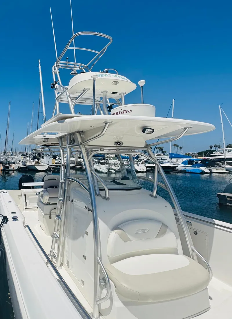 Slide: The Image of 2007 Boston Whaler 320 Outrage boat docked in marina under clear blue sky. - 8