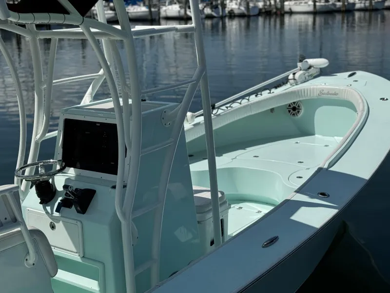 Slide: The Image of 2020 Sabalo 27 boat with sleek design, docked at marina. - 11