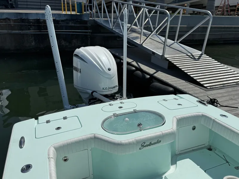 Slide: The Image of 2020 Sabalo 27 boat with Yamaha engine docked at marina. - 12