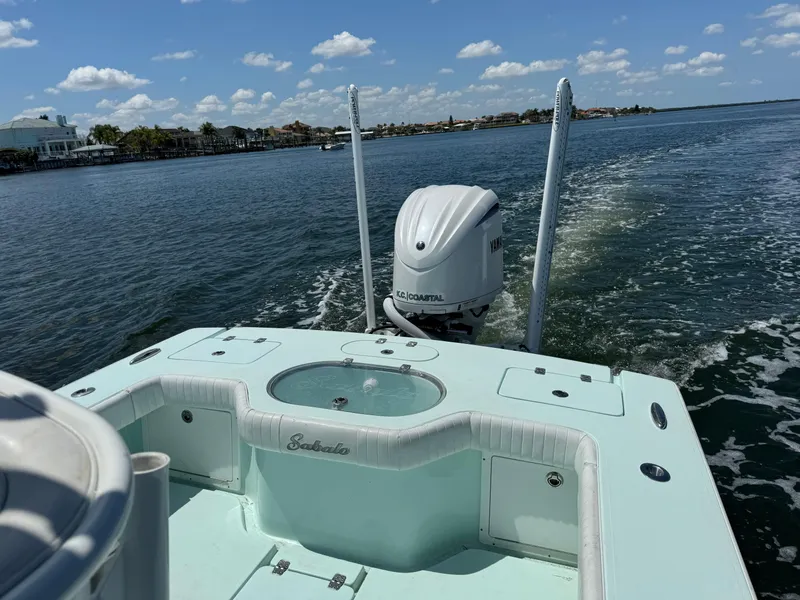 Slide: The Image of 2020 Sabalo 27 boat cruising on a sunny day with Yamaha outboard motor. - 16