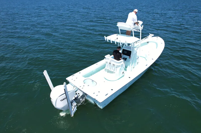 Slide: The Image of 2020 Sabalo 27 boat on open water with two people onboard. - 3