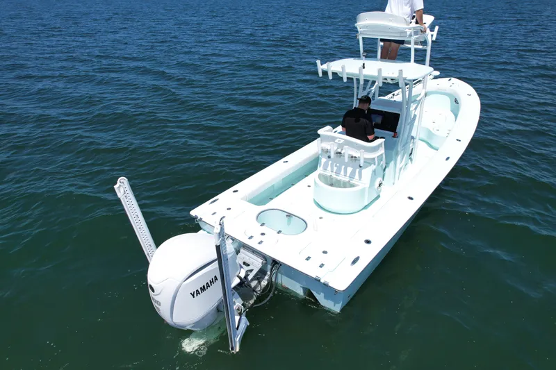 Slide: The Image of 2020 Sabalo 27 boat with Yamaha engine cruising on open water. - 4