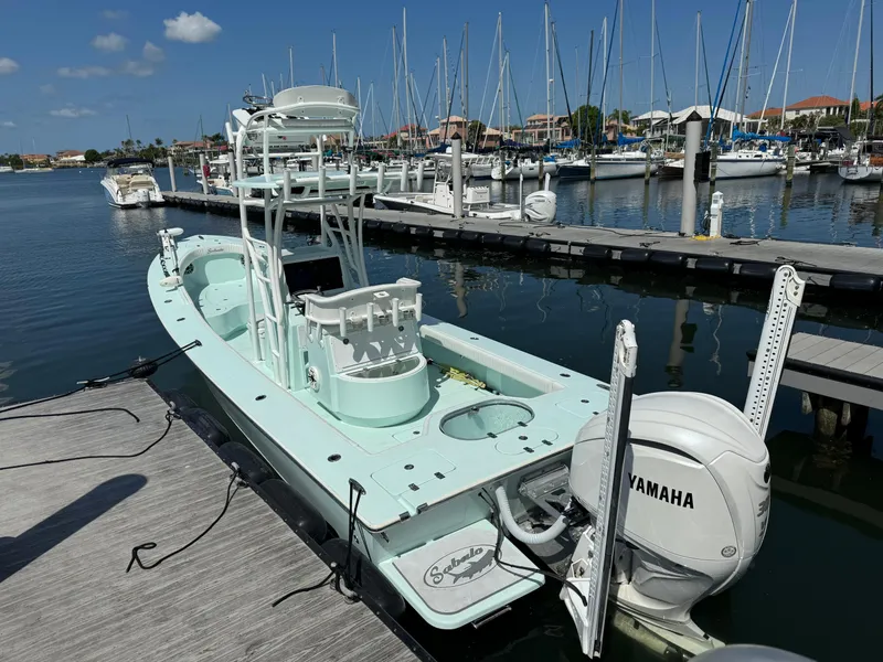Slide: The Image of 2020 Sabalo 27 boat docked at marina with Yamaha engine. - 6