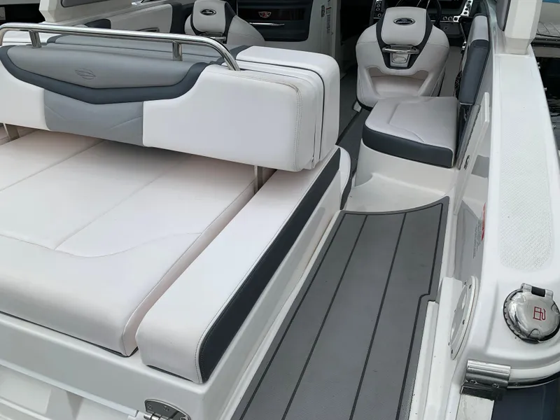 Slide: The Image of 2021 Chaparral 267 SSX boat interior with sleek seating and modern design. - 31