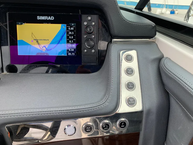Slide: The Image of Dashboard of 2021 Chaparral 267 SSX boat with Simrad navigation display. - 37