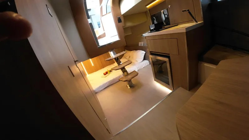 Slide: The Image of Luxurious interior of 2025 NX Boats NX50 Invictus HT with modern amenities and cozy seating. - 17