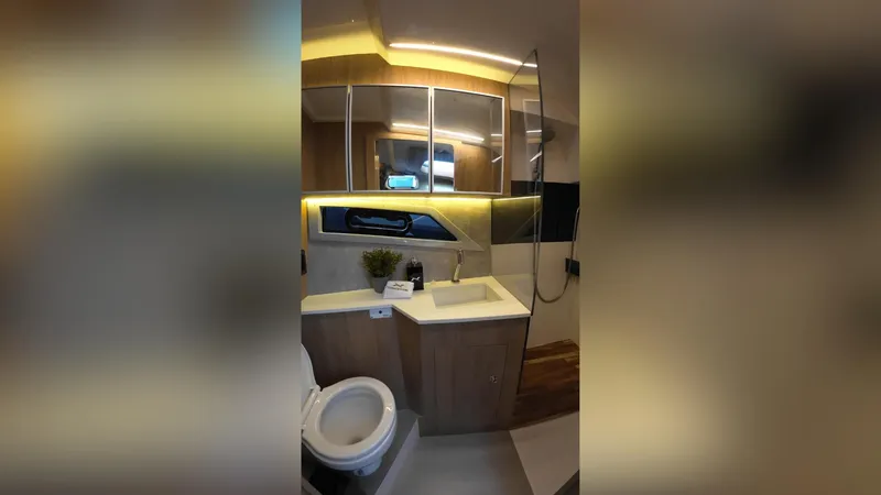 Slide: The Image of Luxurious bathroom interior of 2025 NX Boats NX50 Invictus HT yacht, featuring modern fixtures. - 19