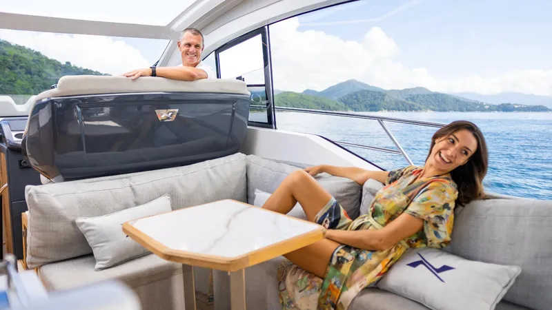 Slide: The Image of Couple enjoying luxury on 2025 NX Boats NX50 Invictus HT yacht, scenic ocean view. - 26