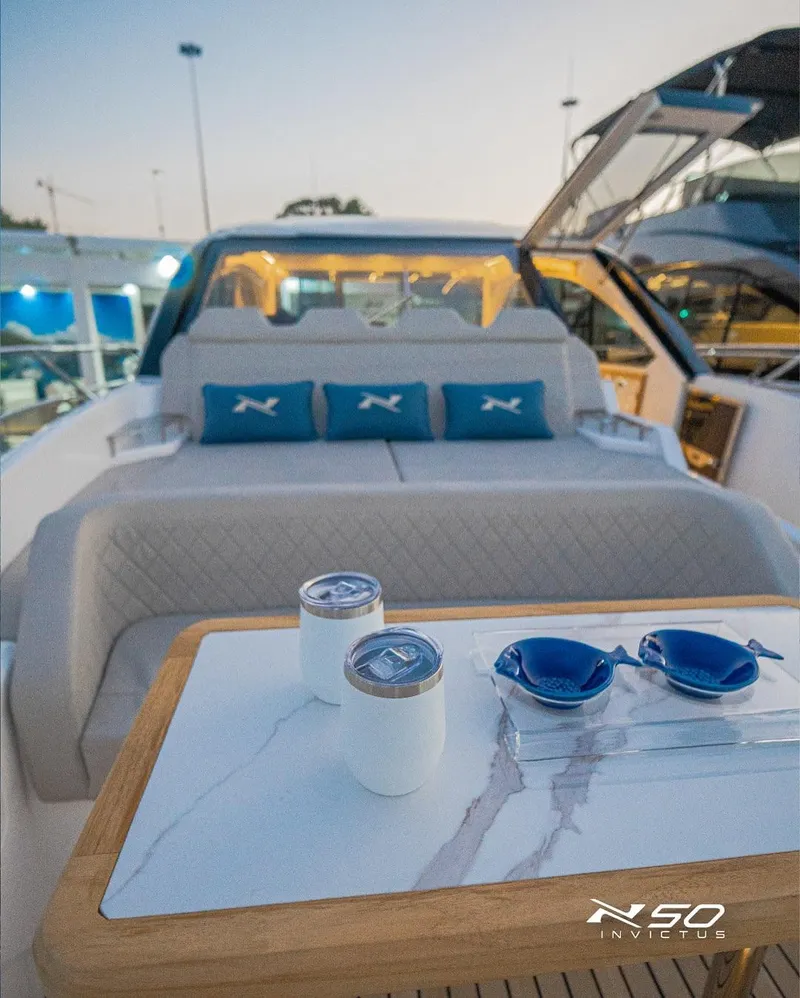 Slide: The Image of Luxury NX 50 INVICTUS HT yacht interior with elegant seating and stylish accessories, 2025 model. - 31