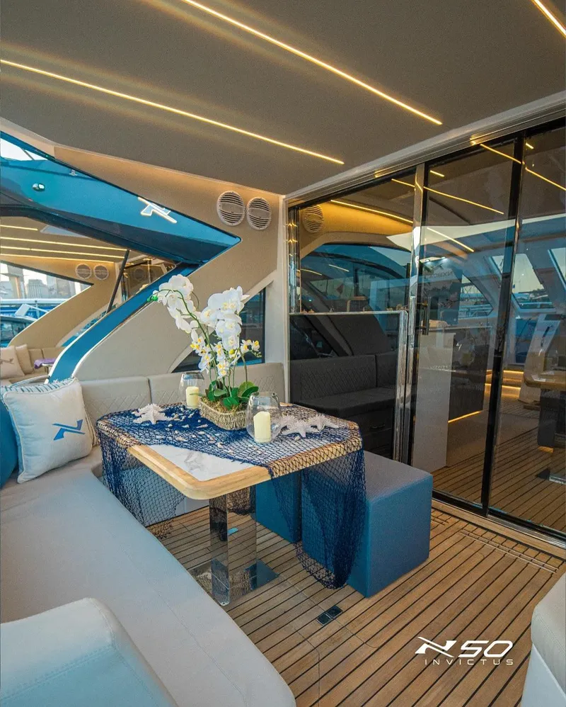 Slide: The Image of Luxurious interior of 2025 NX Boats NX 50 INVICTUS HT yacht with elegant seating and decor. - 37