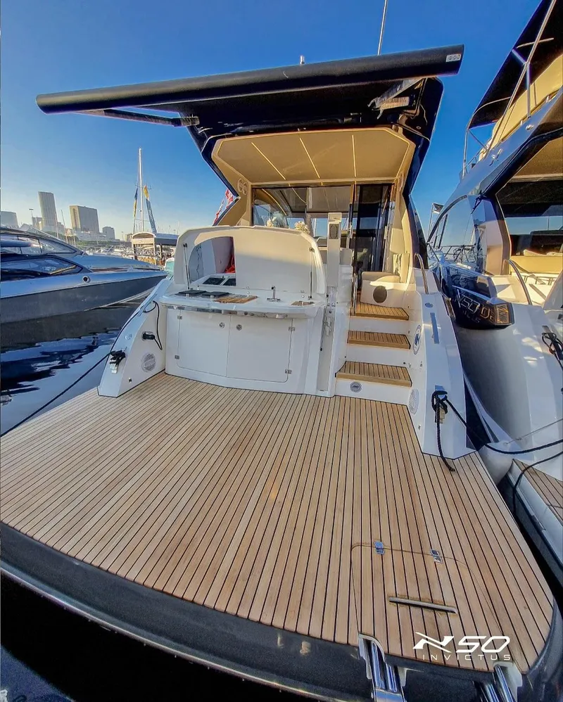 Slide: The Image of 2025 NX Boats NX 50 INVICTUS HT yacht with spacious deck and modern design. - 38