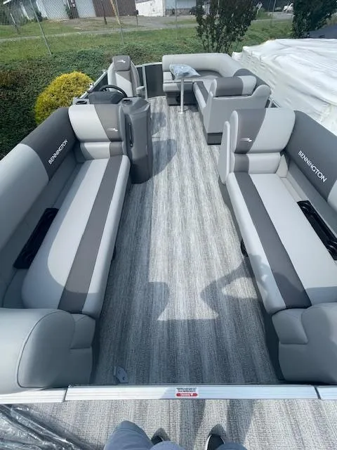Slide: The Image of 2025 Bennington S21 Cruise pontoon boat interior with gray seating and modern design. - 10