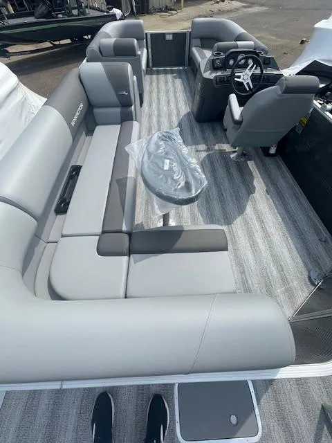 Slide: The Image of 2025 Bennington S21 Cruise pontoon boat with spacious seating and modern interior design. - 5