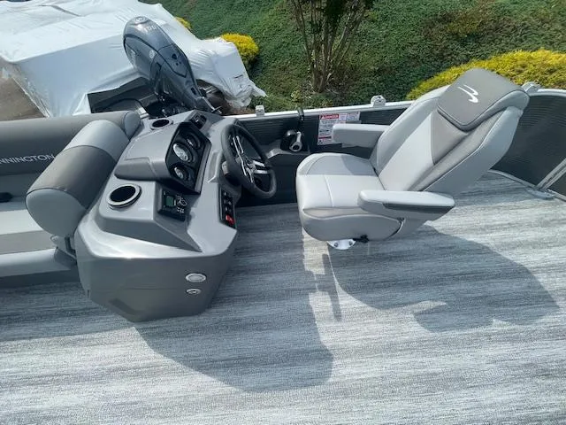 Slide: The Image of 2025 Bennington S21 Cruise boat interior with steering console and captain's chair. - 8