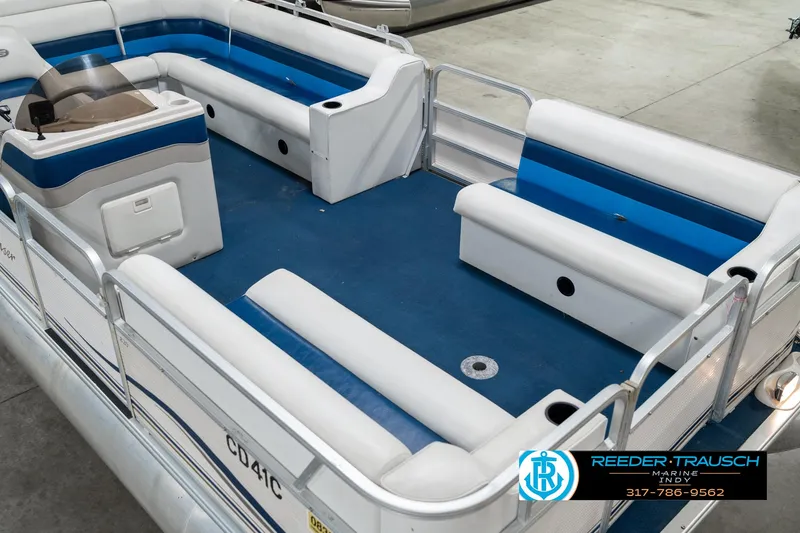 Slide: The Image of 2005 SunChaser 820 pontoon boat with blue and white seating, showcased by Reeder-Trausch Marine. - 12