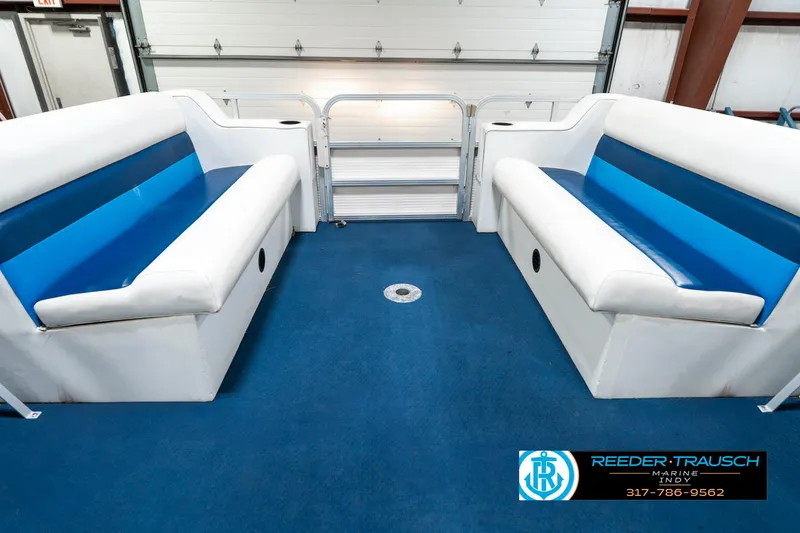 Slide: The Image of Interior of 2005 SunChaser 820 boat with blue and white seating. - 20