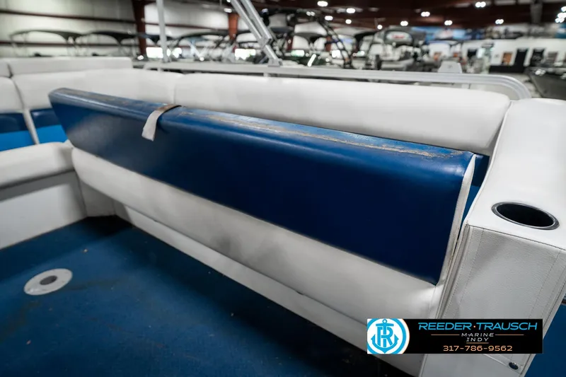 Slide: The Image of Interior of 2005 SunChaser 820 boat with blue and white seating. - 23