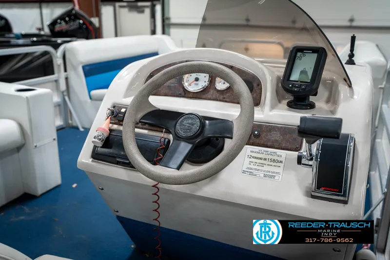 Slide: The Image of Steering console of a 2005 SunChaser 820 boat with gauges and controls. - 27