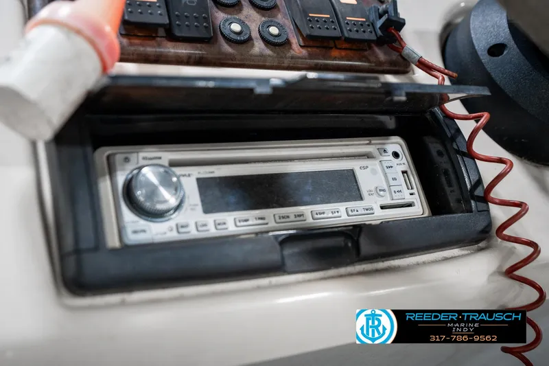 Slide: The Image of 2005 SunChaser 820 boat dashboard with stereo system and control panel. - 29