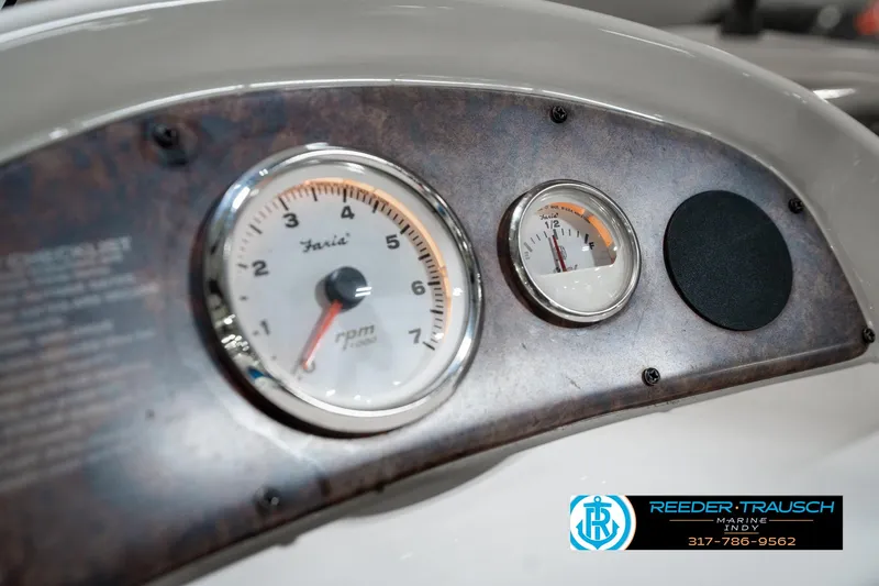 Slide: The Image of Dashboard of a 2005 SunChaser 820 boat with RPM and fuel gauges. - 31