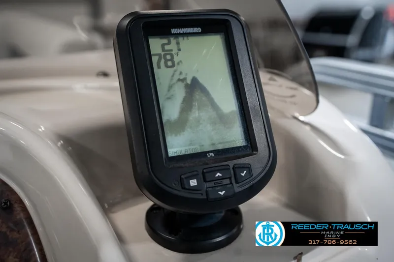 Slide: The Image of Fishfinder display on a 2005 SunChaser 820 boat dashboard, showing temperature and depth readings. - 32