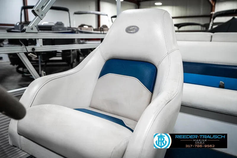 Slide: The Image of White and blue boat seat in a 2005 SunChaser 820, showroom setting. - 33