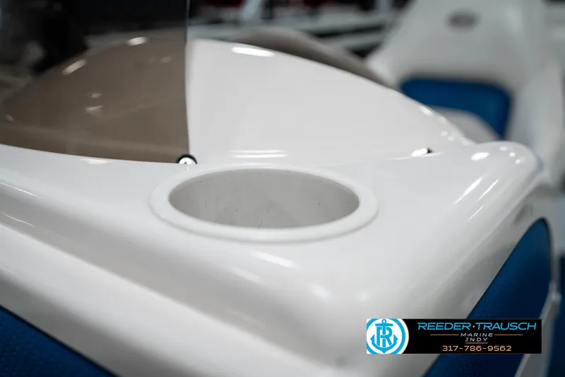 Slide: The Image of Close-up of a 2005 SunChaser 820 boat's cup holder and seating area. - 35