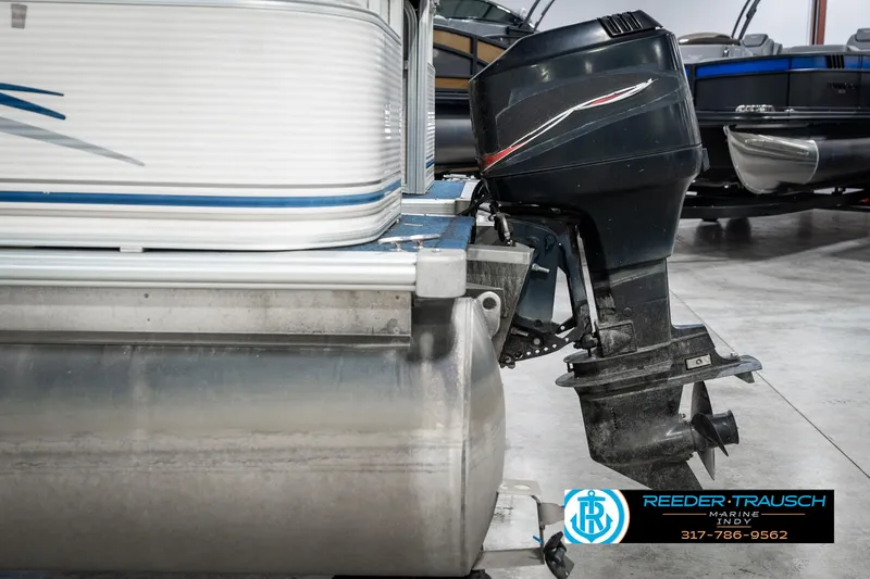 Slide: The Image of 2005 SunChaser 820 pontoon boat with outboard motor in showroom. - 38