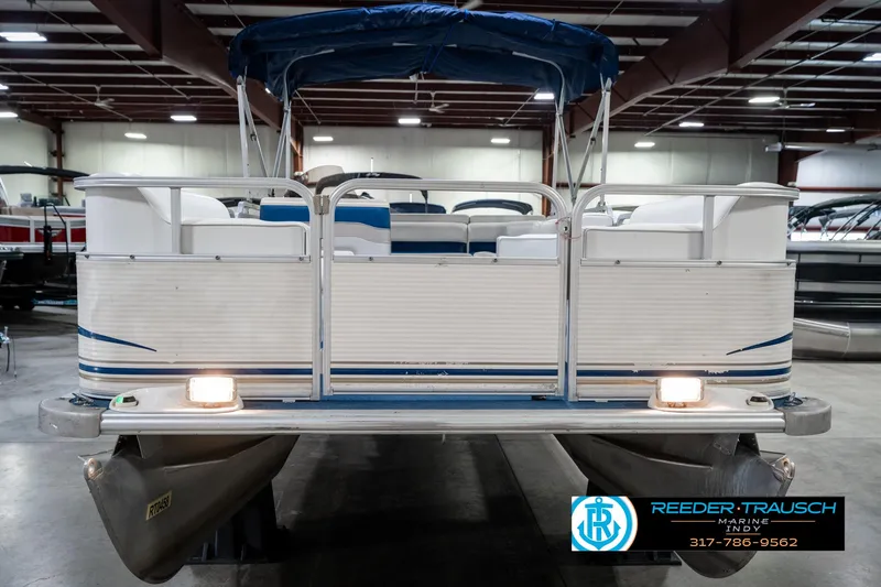 Slide: The Image of 2005 SunChaser 820 pontoon boat in indoor showroom, rear view with canopy. - 4